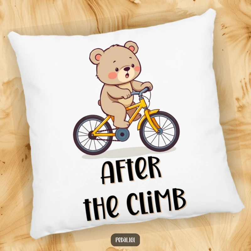 Funny bear pedaling a yellow bicycle uphill with effort, printed on a soft and humorous decorative pillow.