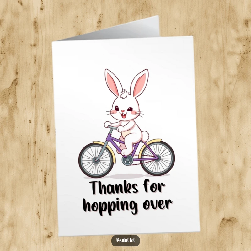 Funny Free Printable Thank You Card: A happy bunny with a determined grin pedals a colorful bicycle, expressing thanks.