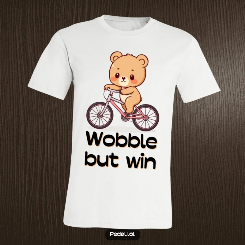 Funny Bear Cub Bicycle Wobble T-Shirt: An illustration of a bear cub humorously trying to balance on a bicycle with a funny wobble, a great gift.